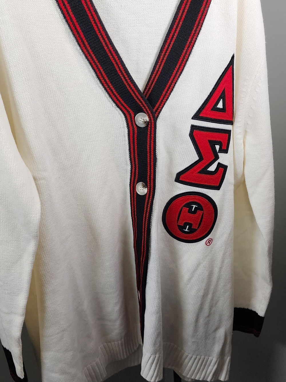 Cream Cardigan with Red & Black Trim and Patch Detail